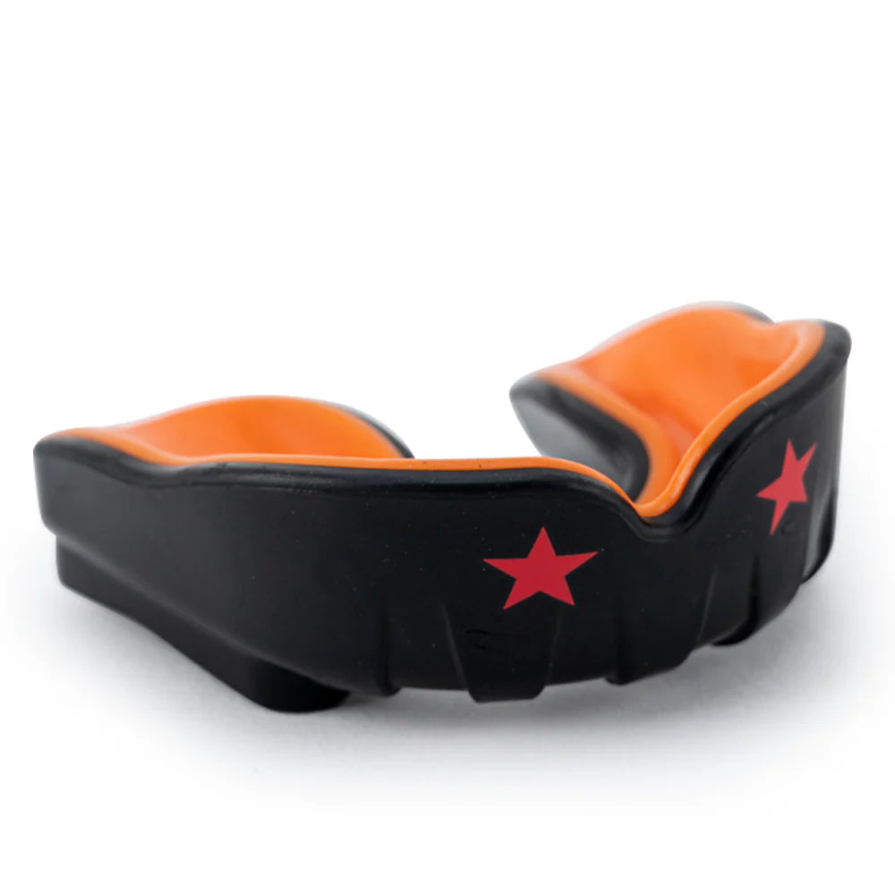 Black and orange mouthguard with red stars on a white background