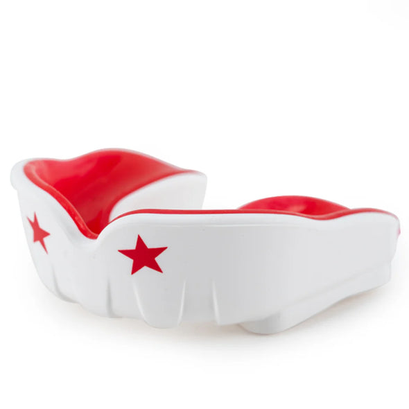 White mouthguard with red interior and stars on a white background
