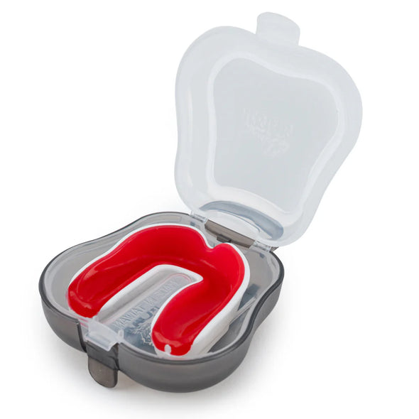 Red mouthguard in a clear plastic case on a white background