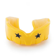 Yellow mouthguard with black stars on a white background