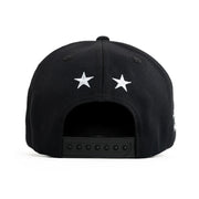 Black cap with white stars on a white background
