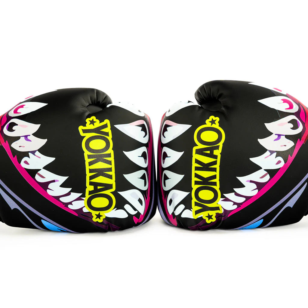 Pair of black boxing gloves with colorful designs and 'Yokkao' branding on a white background