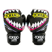 Pair of Yokkao boxing gloves with shark mouth design on a white background