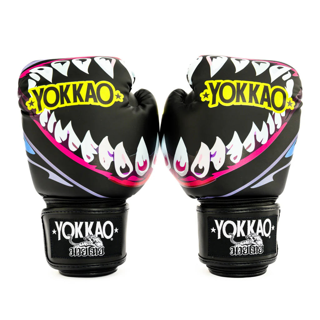 Pair of Yokkao boxing gloves with shark mouth design on a white background
