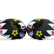 Pair of black boxing gloves with colorful designs and yellow stars on a white background