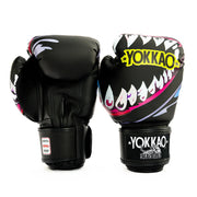Black boxing gloves with shark design and 'Yokkao' branding on a white background