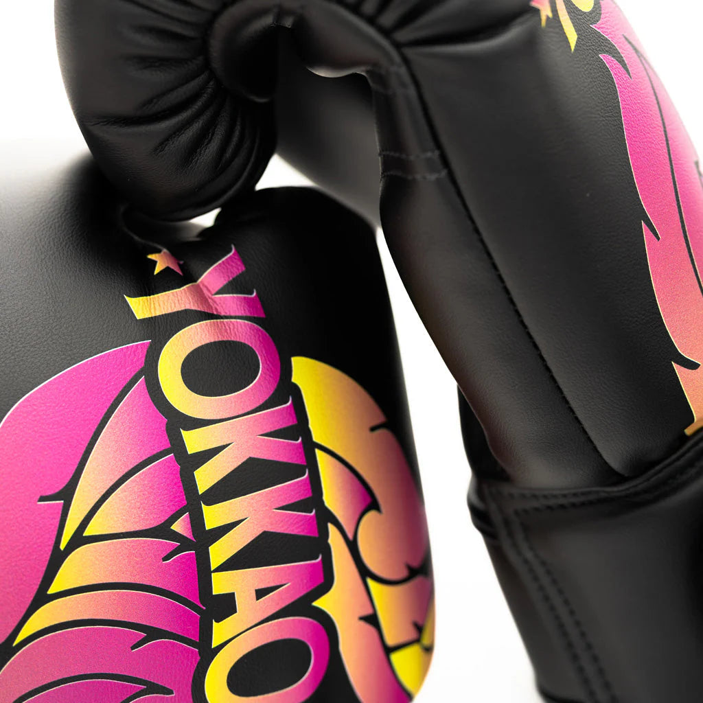 Black boxing glove with colorful YOKKAO branding on a white background