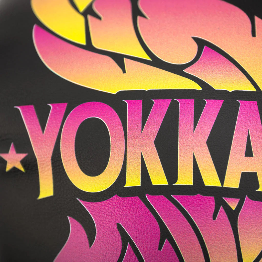 Colorful 'YOKKA' logo on a black background