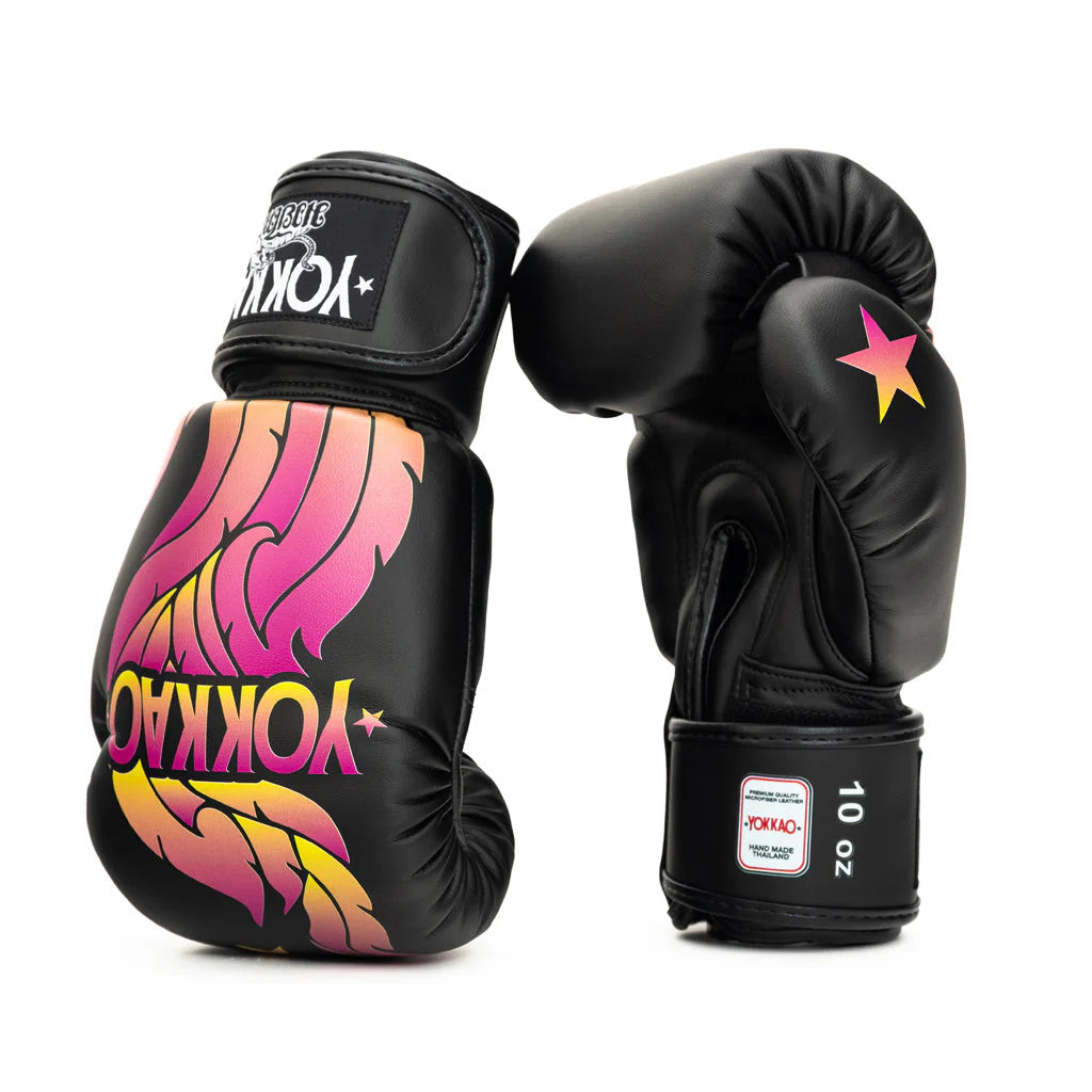 Black boxing gloves with colorful designs and 'YOKKAO' branding on a white background