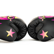 Black boxing gloves with pink and yellow star designs on a white background