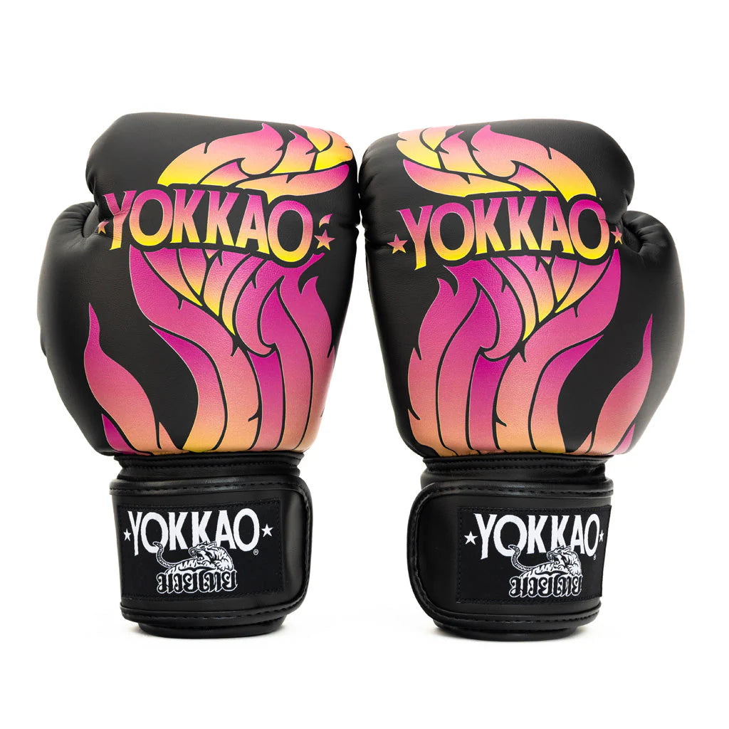 Pair of Yokkao boxing gloves with colorful flame design on a white background