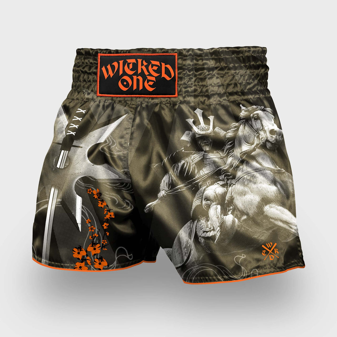 Fight shorts with graphic design and 'Wicked One' branding on a light gray background