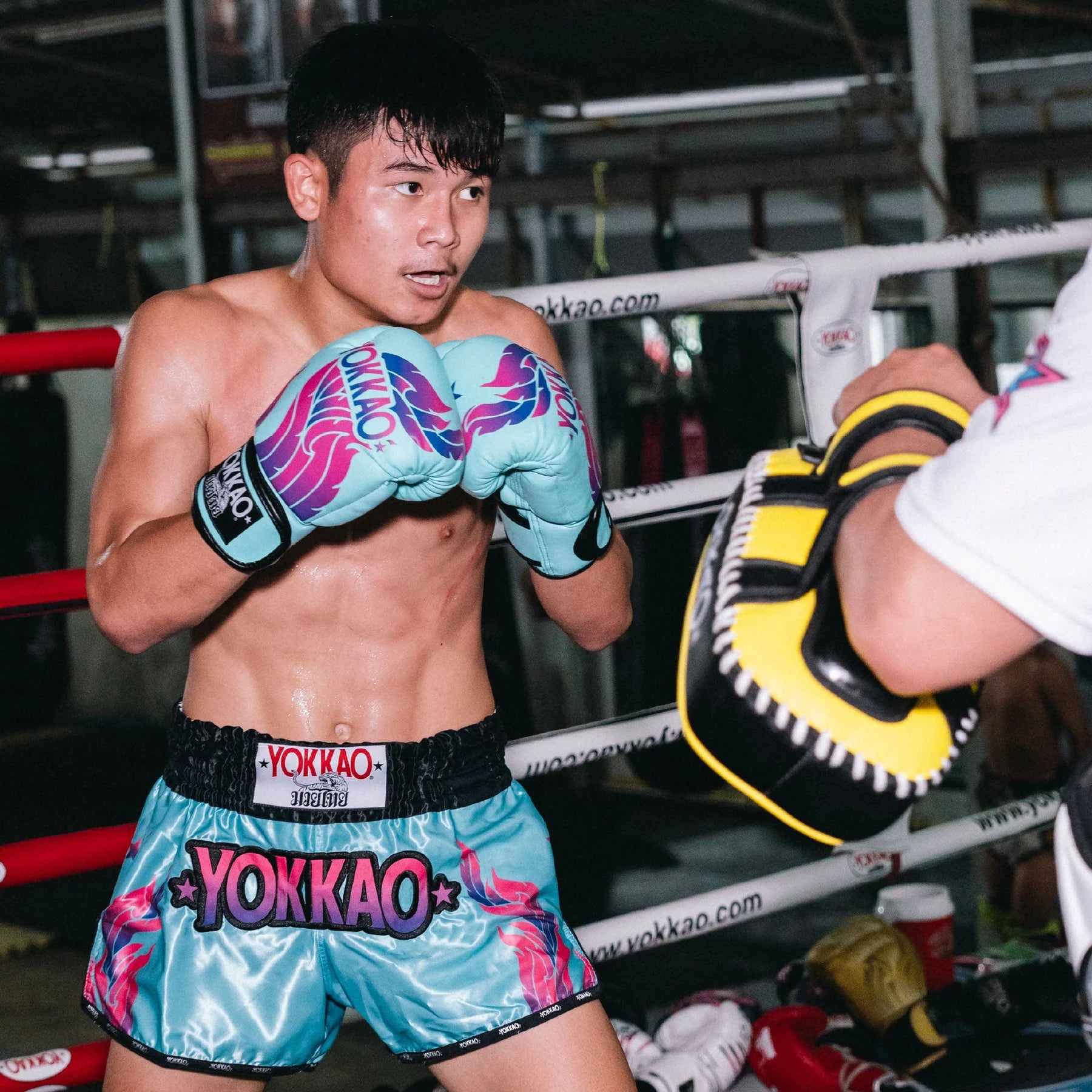 Boxer in Yokkao gear training in a boxing ring.