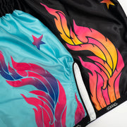 Colorful swim shorts with flame design on a black background
