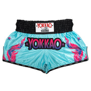 Turquoise boxing shorts with colorful flames and Yokkao branding on a white background