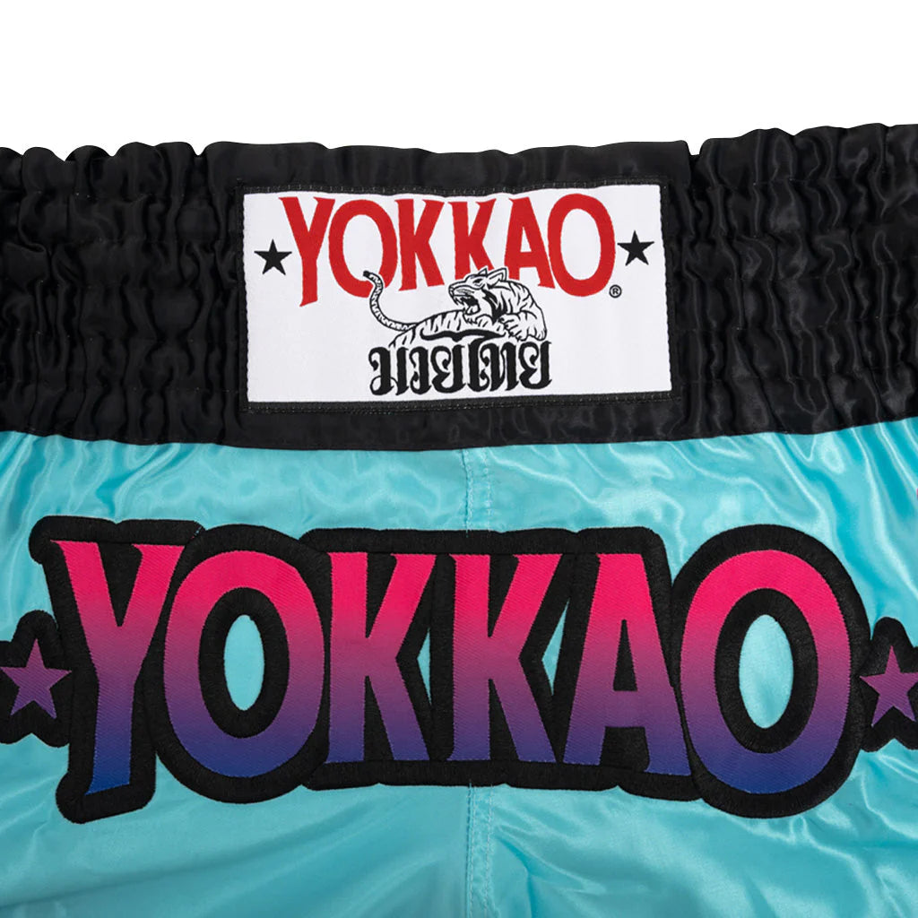 Yokkao branded boxing shorts with a prominent logo on a white background