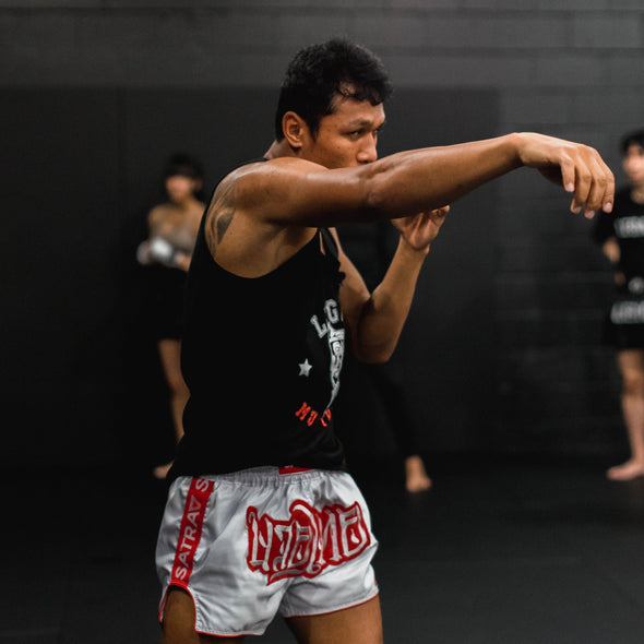 Person practicing martial arts in a gym setting