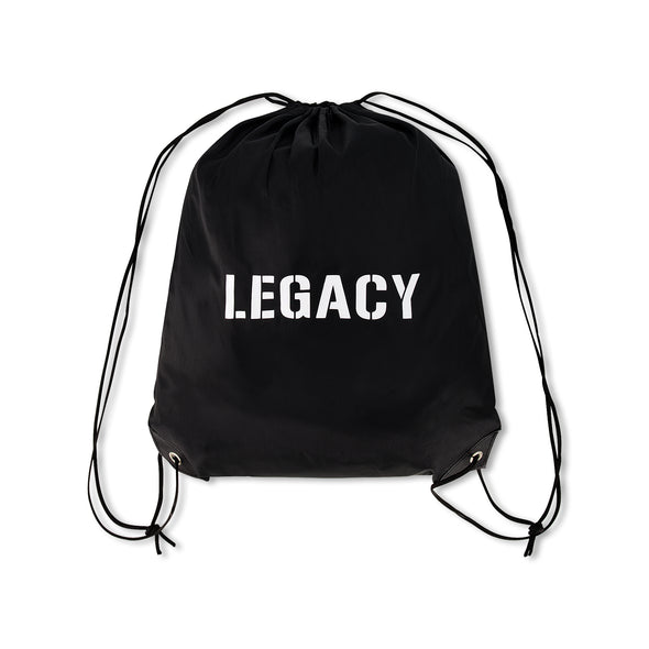 Official Team Legacy BJJ Gi in black, featuring a 450 GSM Pearl Weave Plus jacket, 10 oz cotton drill pants, reinforced stitching, and includes a white belt and drawstring bag.