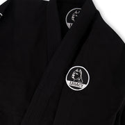 Official Team Legacy BJJ Gi in black, featuring a 450 GSM Pearl Weave Plus jacket, 10 oz cotton drill pants, reinforced stitching, and includes a white belt and drawstring bag.