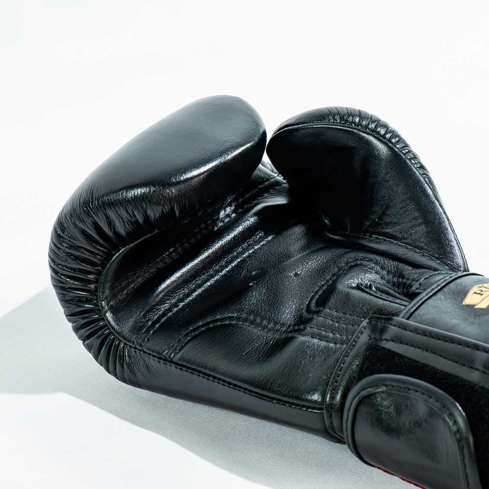 RAJA RBGV-1 standard black Muay Thai gloves made in Thailand with genuine leather and secure wrist support