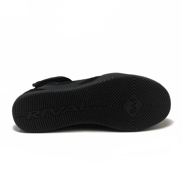 Black sandal with a strap on a white background