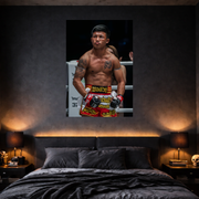Bedroom with a framed picture of a boxer on the wall above the bed.