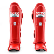 Red shin guards with YOKKAO branding on a white background