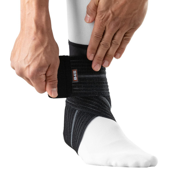 Shock Doctor ankle sleeve with adjustable compression wrap providing moderate support for ankle injuries