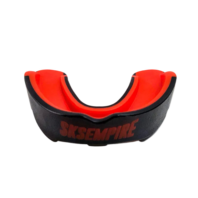 Black and red mouthguard with 'SKSEMPIRE' branding on a gray background