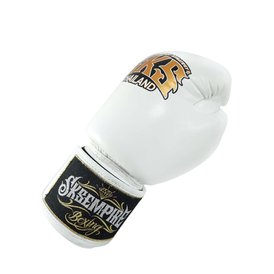 White boxing glove with black and gold branding on a white background