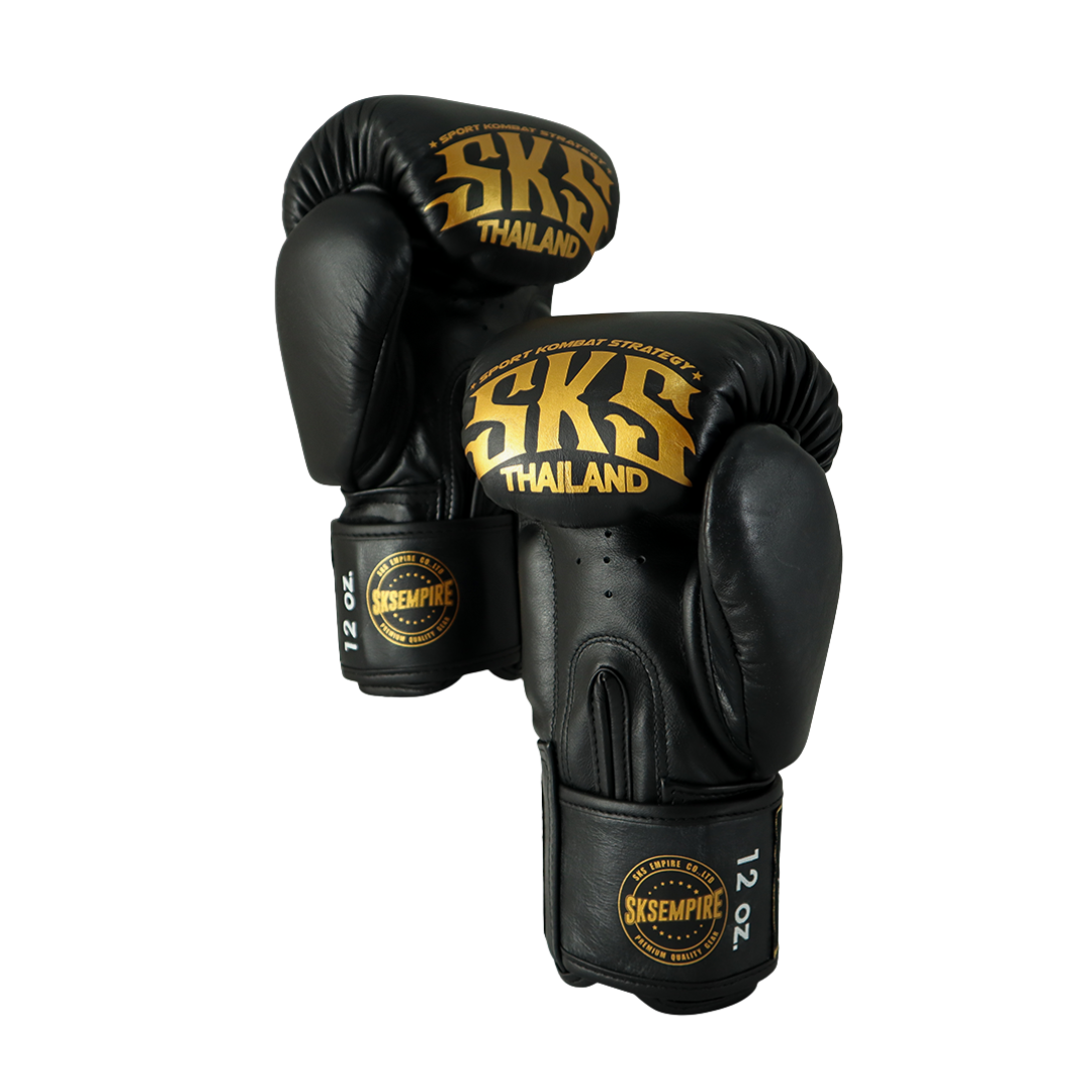 Black boxing gloves with gold 'SKS Thailand' branding on a white background