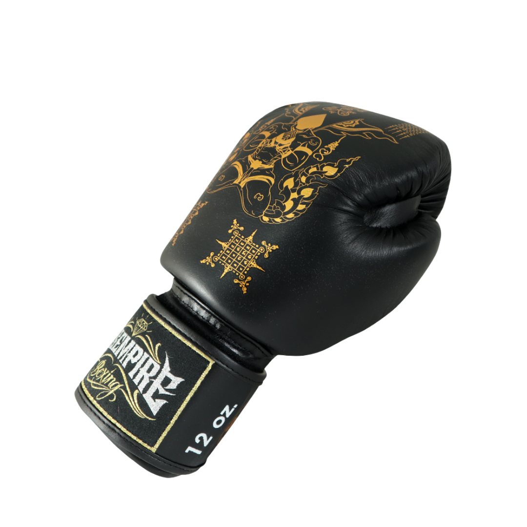 Black boxing glove with gold designs and 'Empire' branding on a white background