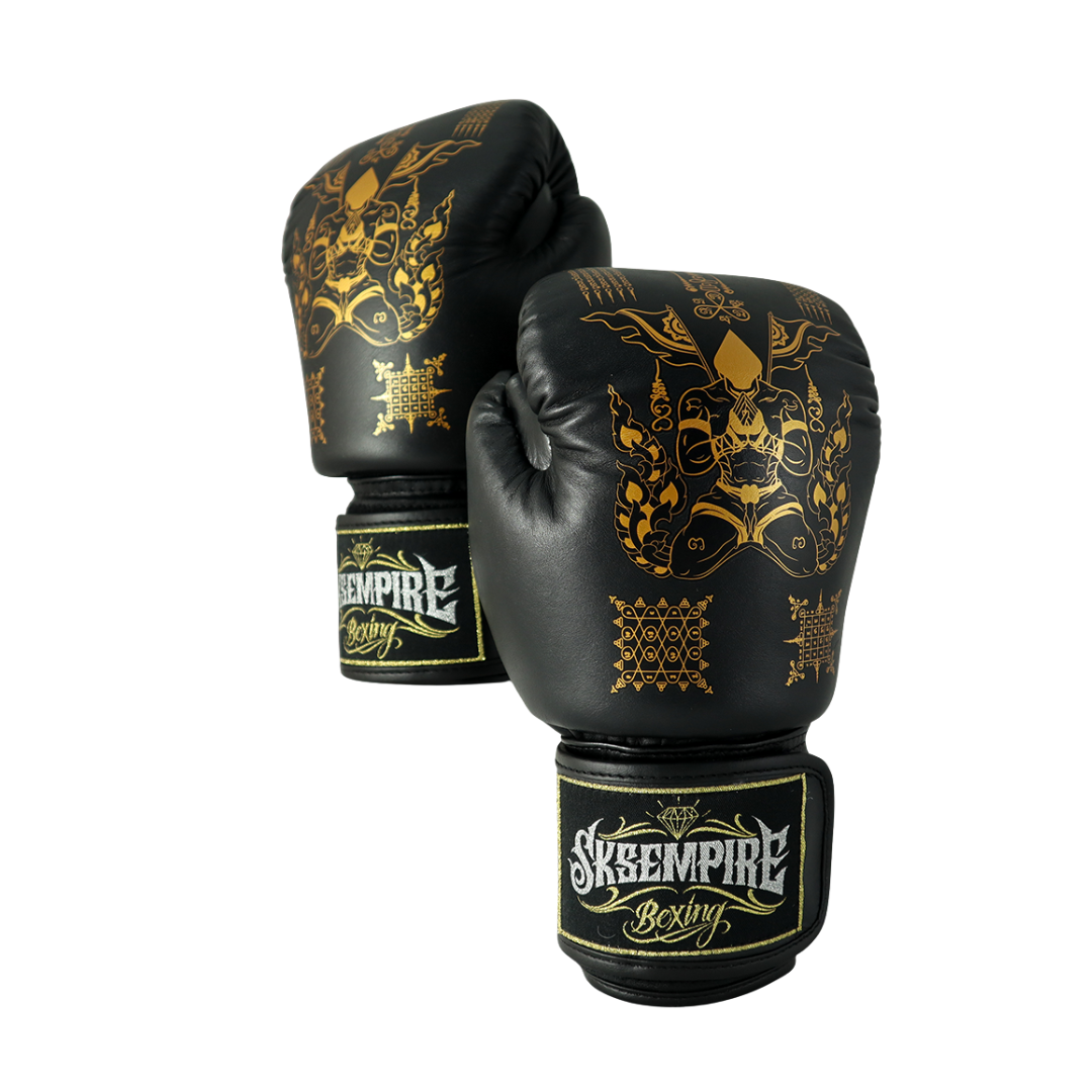 Black boxing gloves with gold designs and 'Sky Empire Boxing' branding on a white background