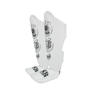 White shin guards with black patterns and branding on a white background