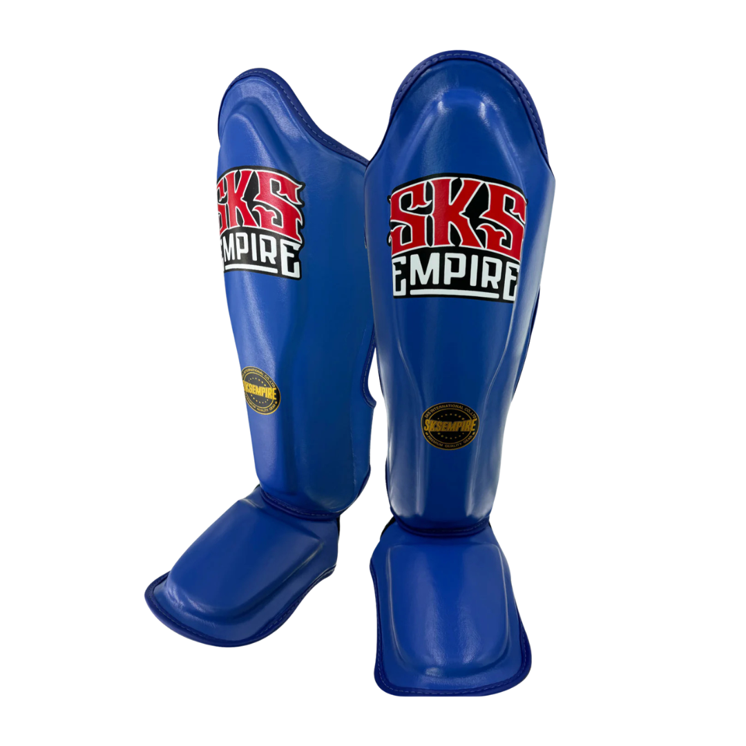 Blue shin guards with SKS Empire branding on a white background