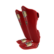 Red shin guards with brand logo on a white background