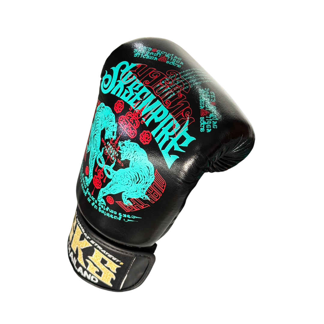 Black boxing glove with colorful graphics and branding on a white background