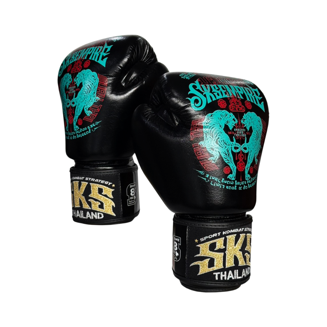 Black boxing gloves with teal and red designs on a white background