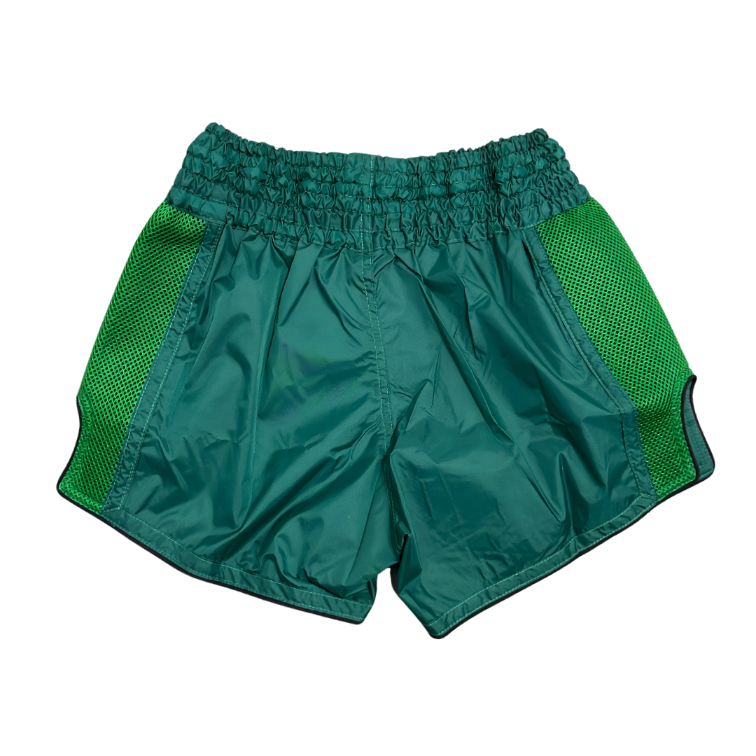 Green athletic shorts with mesh panels on a white background