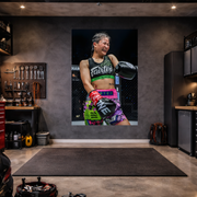 Garage interior with a large poster of a female fighter on the wall.