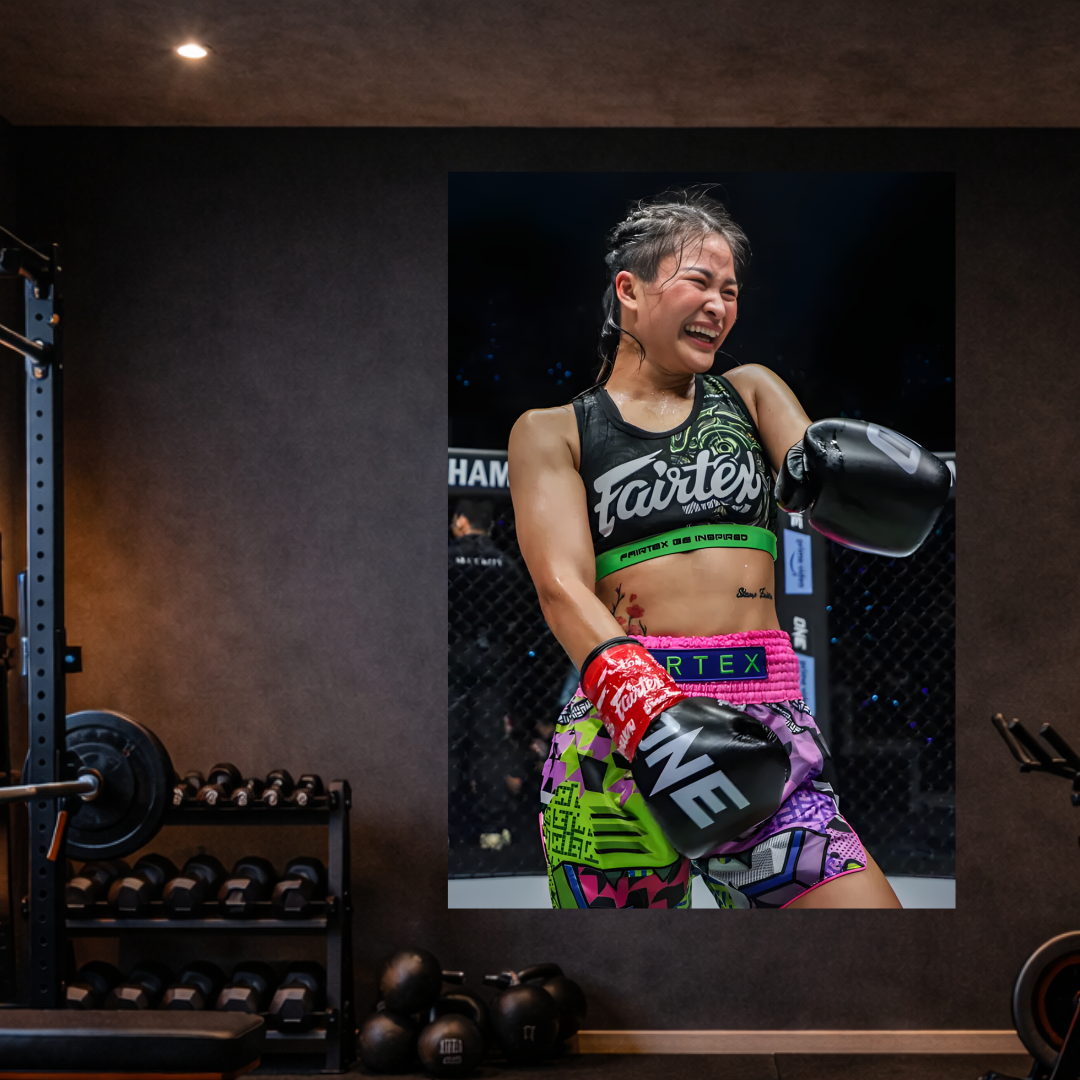 MMA fighter in a gym setting with training equipment.