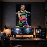 Home office setup with a large poster of a female athlete on a wall above a desk with computer monitors.