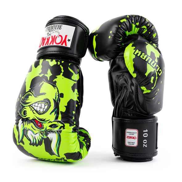 Pair of black and green boxing gloves with a dragon design on a white background