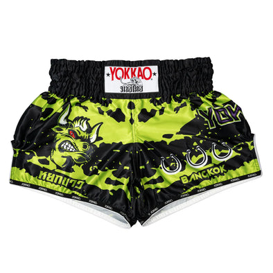 Green and black boxing shorts with YOKKAO branding on a white background