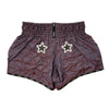 Pair of shorts with star designs on a white background