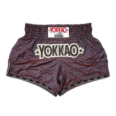 Dark gray shorts with 'YOKKAO' branding on a white background
