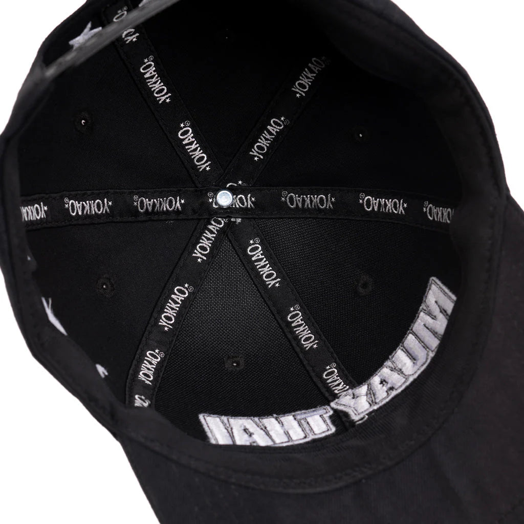 Black cap with white text on a white background
