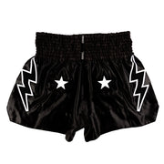 Black shorts with white lightning bolt and star designs on a white background