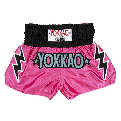 Pink Yokkao boxing shorts with black lightning bolt designs on a white background