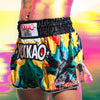 Colorful boxing shorts with 'YOKKAO' branding on a blurred background